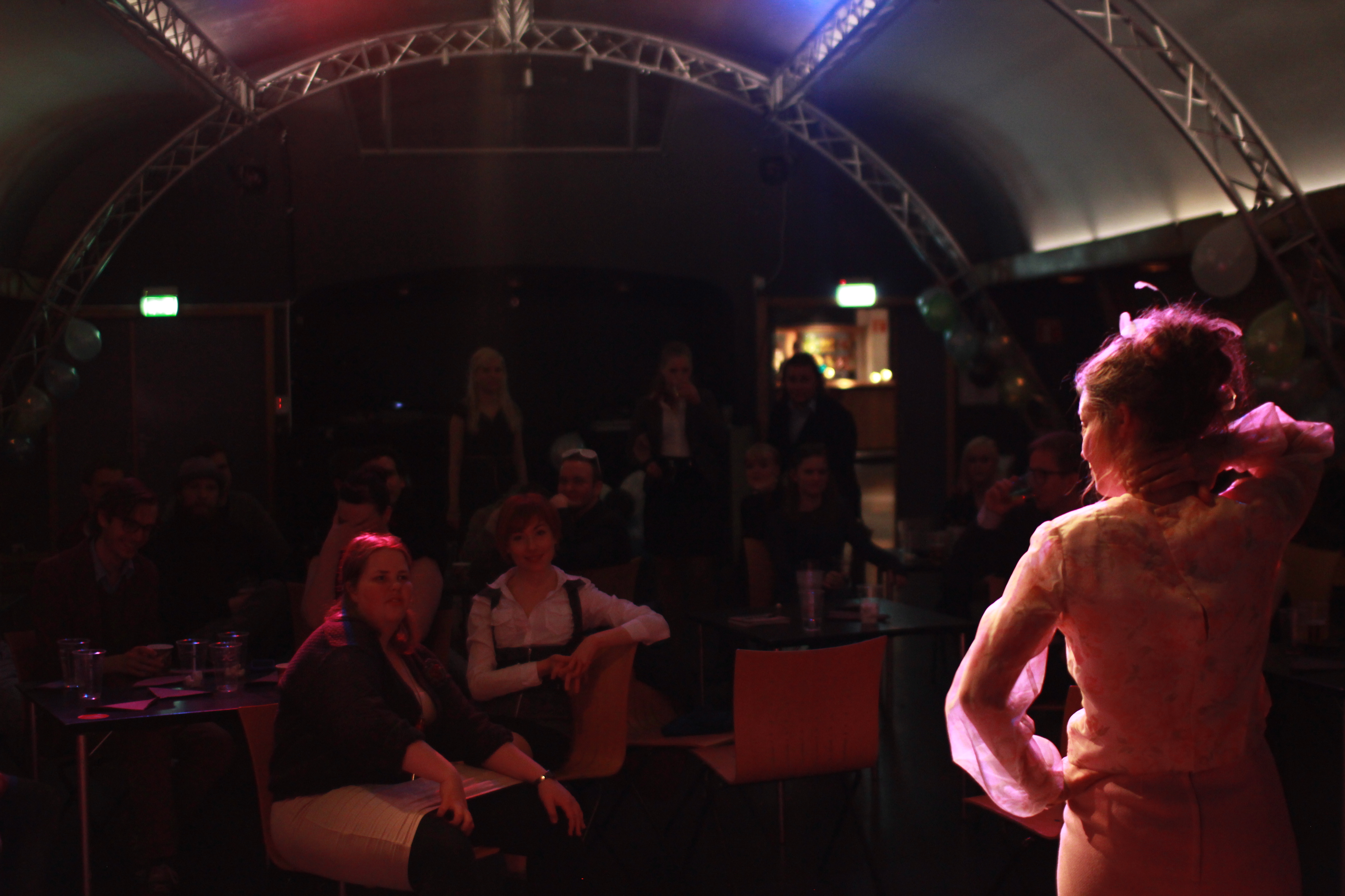 Gerd Johnsen played by Henriette giving a speech to the firm's employees revealing the troubles the firm's in. 