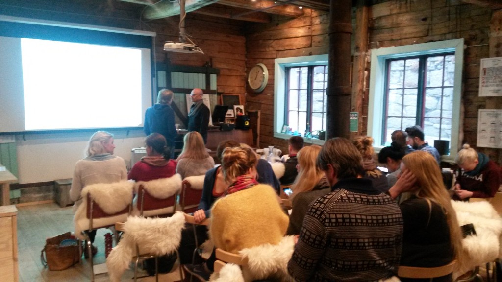 A crowd gathered at The Hub for a presentation.